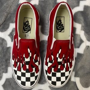 Checkered slip on vans with red flames